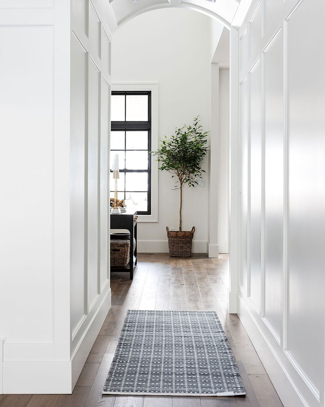 Example of an outdoor / indoor rug that is in a hallway.Mcgee and Co