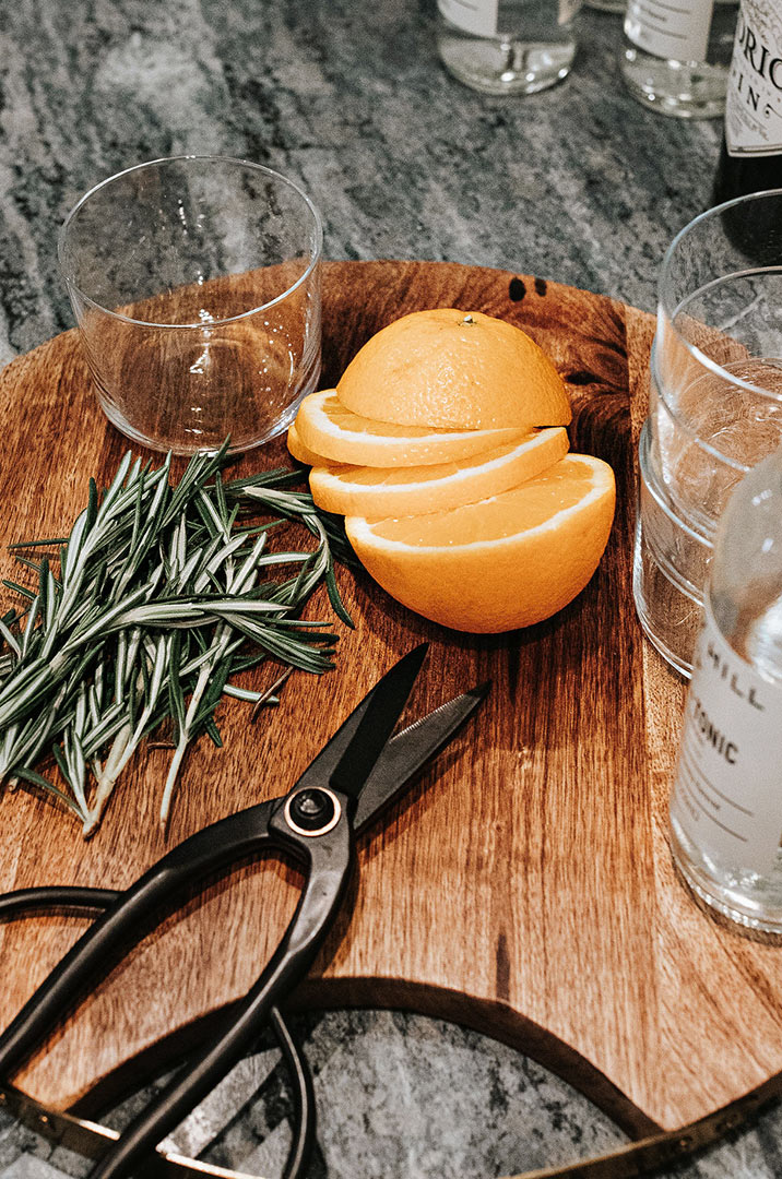 Cutting Board on Soapstone Countertops with Orange Rosemary Gin and Tonics - Design by Jenny Murphy of J. Reiko Design + Co.          
