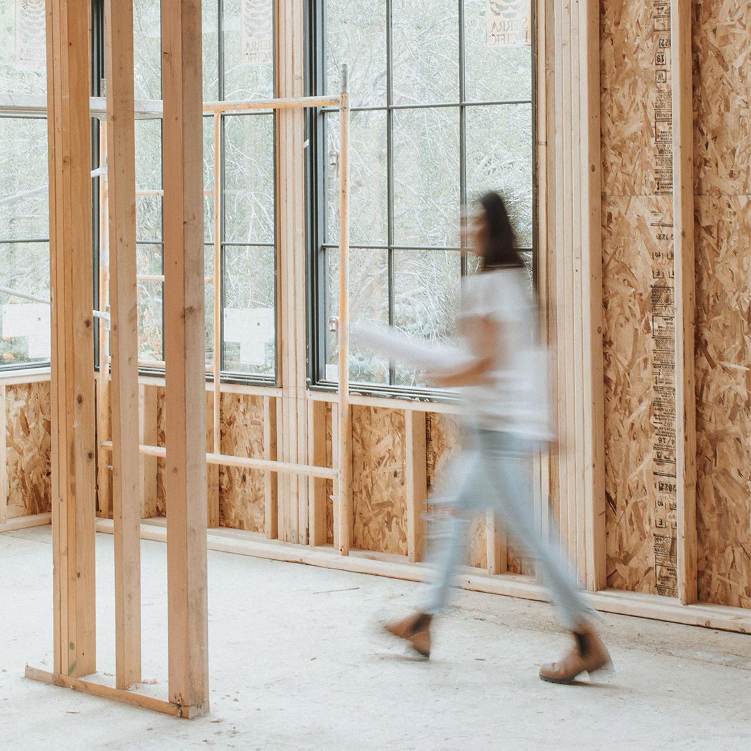 Jennifer Murphy is shown in a blur of motion as she walks the construction site of one of her projects for J. Reiko Design + Co