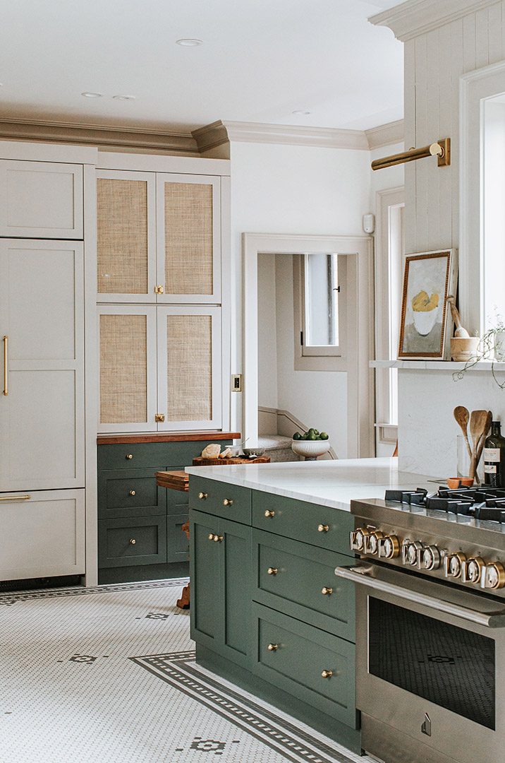 Baker's cabinet in a traditional remodel with cane webbing and brass features. 