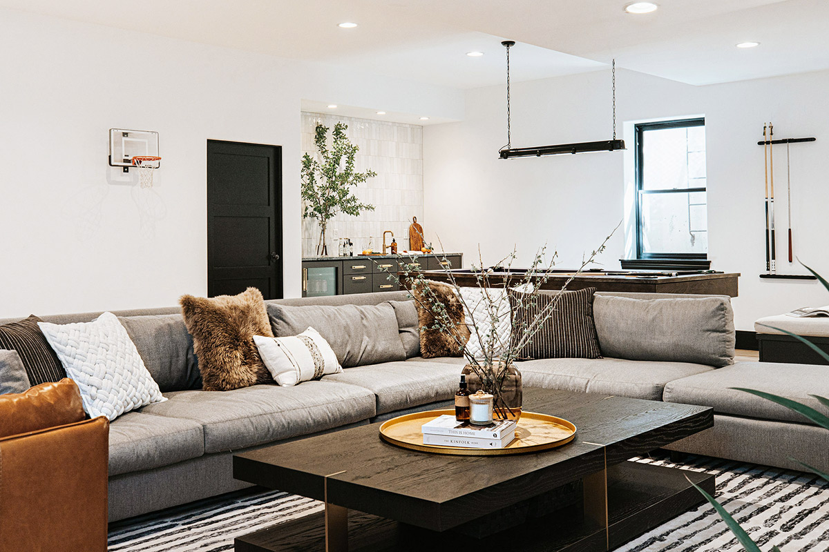 Industrial Modern Basement Design with Black, Brass and Mixed Neutral Textures by Jenny Murphy of J. Reiko Design + Co. 