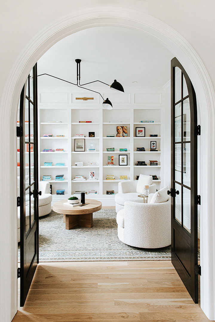 Organic minimalist interior design is highlighted in mordern built-in shelving of this library in Cherry Creek Colorado