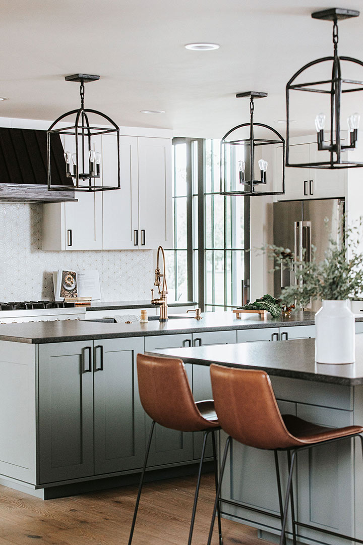Lantern Pendant light, leather bar stools and a double island make this modern farmhouse kitchen design tie together