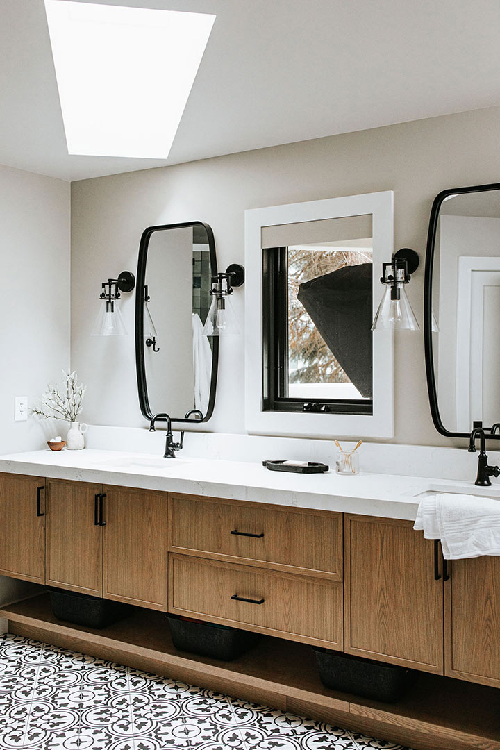 Double white oak vanity with two black framed mirrors in Fort Collins Colorado