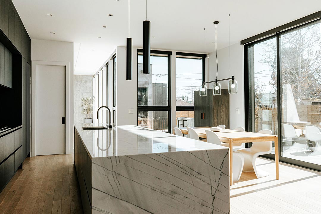 Front and center you can view the graining and detail in the marble waterfall slab countertop selected for the island by Jenny Murphy of J. Reiko Design + Co. 