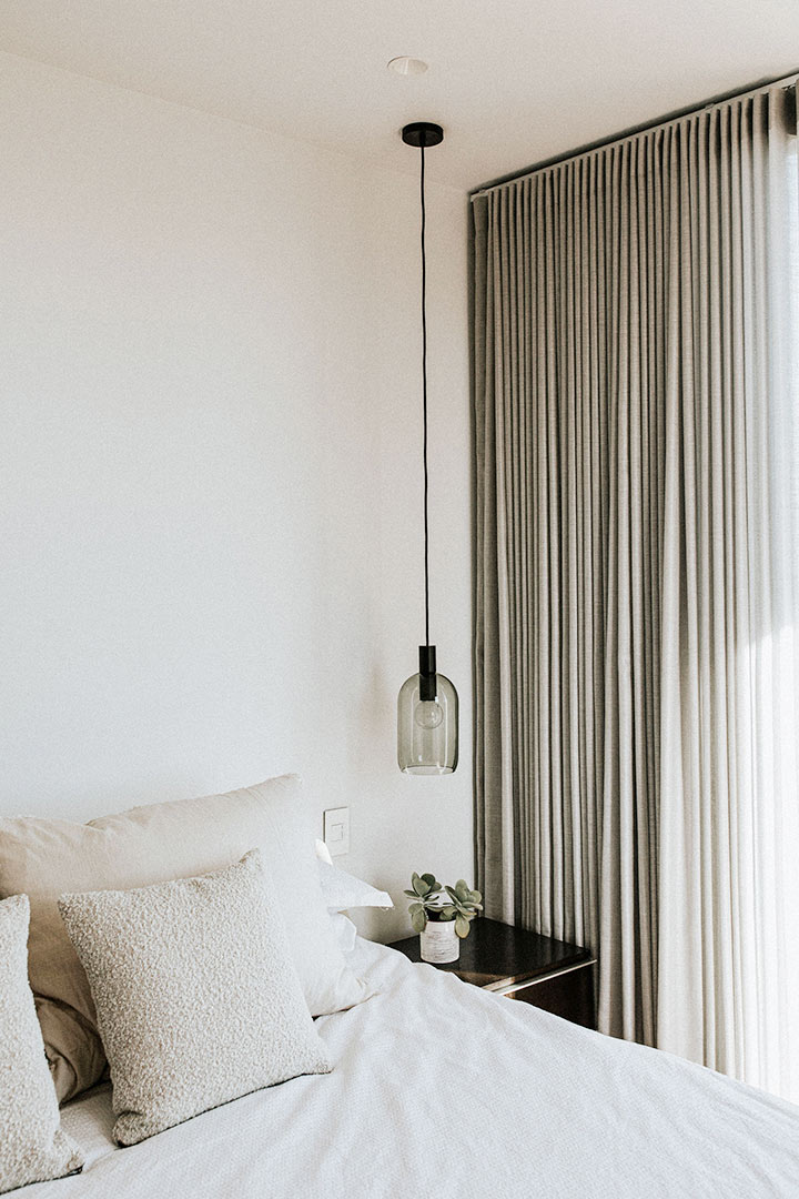 Detailed view of the natural textures and tone work in this modern Scandinavian bedroom design.