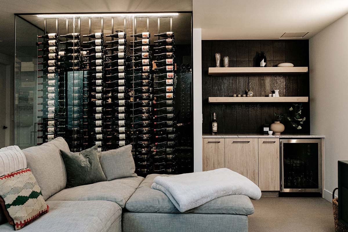 Basement saki bar and massive Wine wall created a backdrop for this Denver new build's home design by J. Reiko Design + Co. 