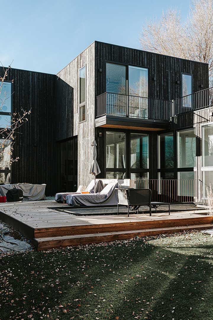 The backyard of this modern japandi new build home in Denver's Sunnyside neighborhood matches the interior – modern and minimal architecture and design. 