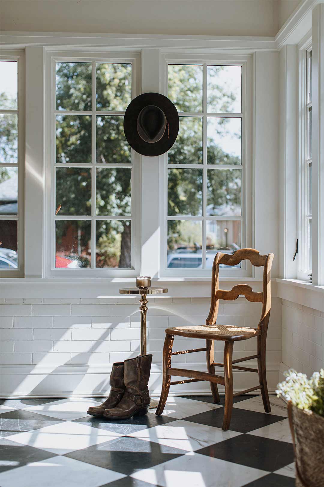 Historic remodel's sunroom with transitional elements styled by Jenny Murphy of J. Reiko Design + Co