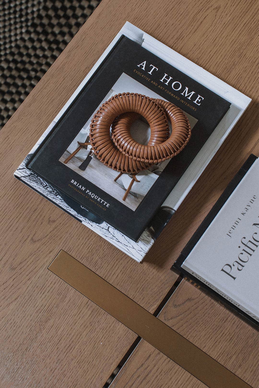 A top down view of the styling and books on the coffee table of this Organic-Modern Historic Remodel