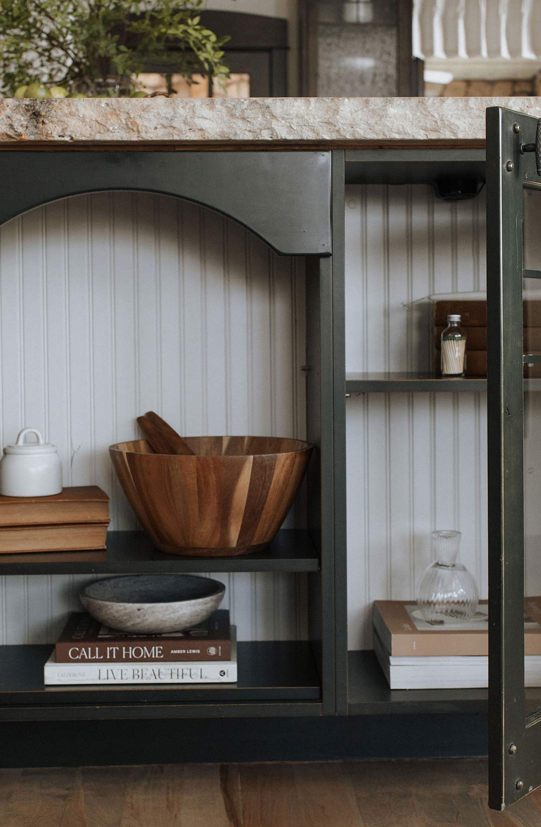 Custom made island storage with cabinet doors and shelves styled by Jennifer Murphy of J. Reiko Design + Co