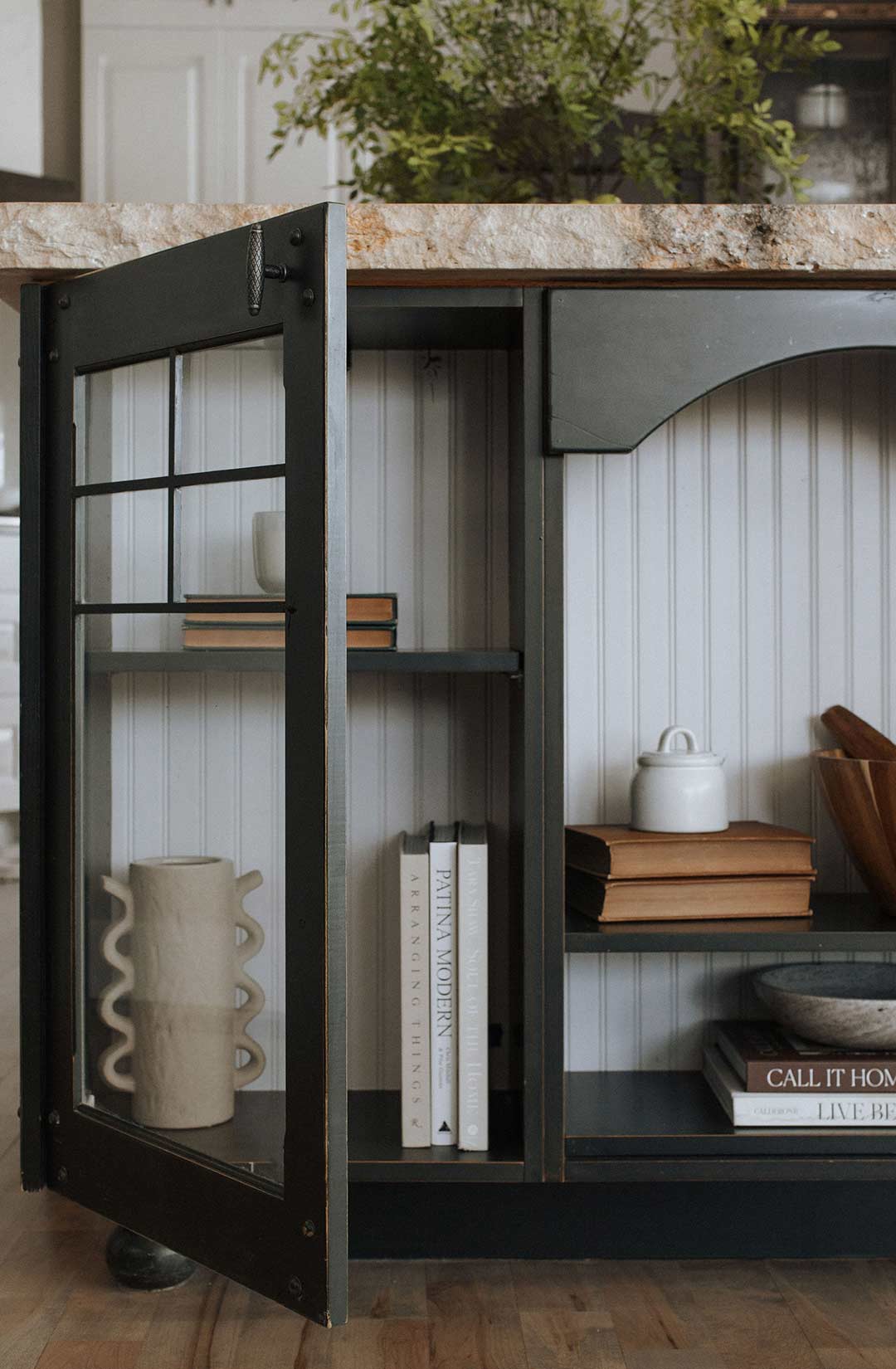 Custom made island storage with cabinet doors and shelves styled by Jennifer Murphy of J. Reiko Design + Co