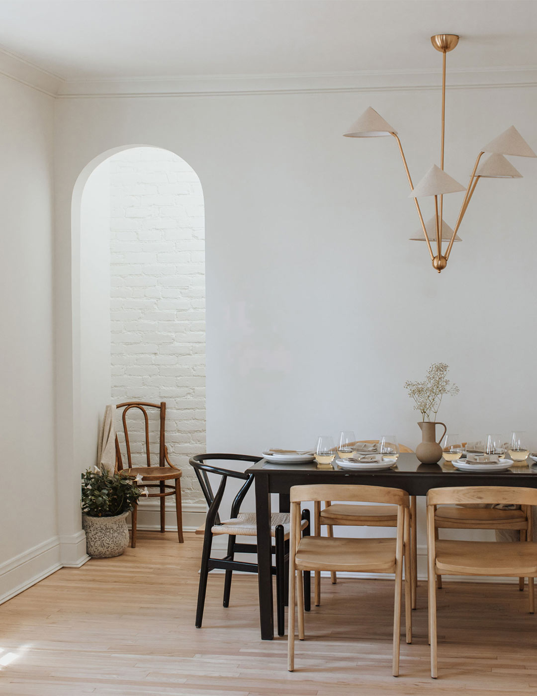 J. Reiko Design + Colonial Revival - 14 Historic-modern dining room shows off the arched doorways and openings or this Victorian house remodel.