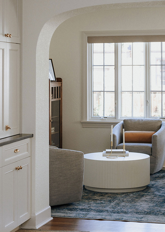 J. Reiko Design + Co. - Open vs. Closed Concept - 13 An example of a home design with an adjust to the traditional layout by having the home builder do an addition with a unique arched opening to add a separate living space with a connected dining area of this historic home renovation. Designed by J. Reiko Design + Co.