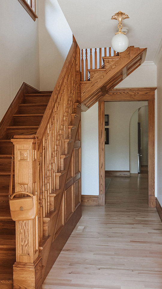 J. Reiko Design + Co. - Selecting Finishes - 3 Custom trim and molding in a historic home renovation in Denver colorado showcase how important updated the details in the interior design selections is for a historic home. Shown is the staircase banister and door trim and moulding. Thoughtfully designed by J. Reiko Design + Co.
