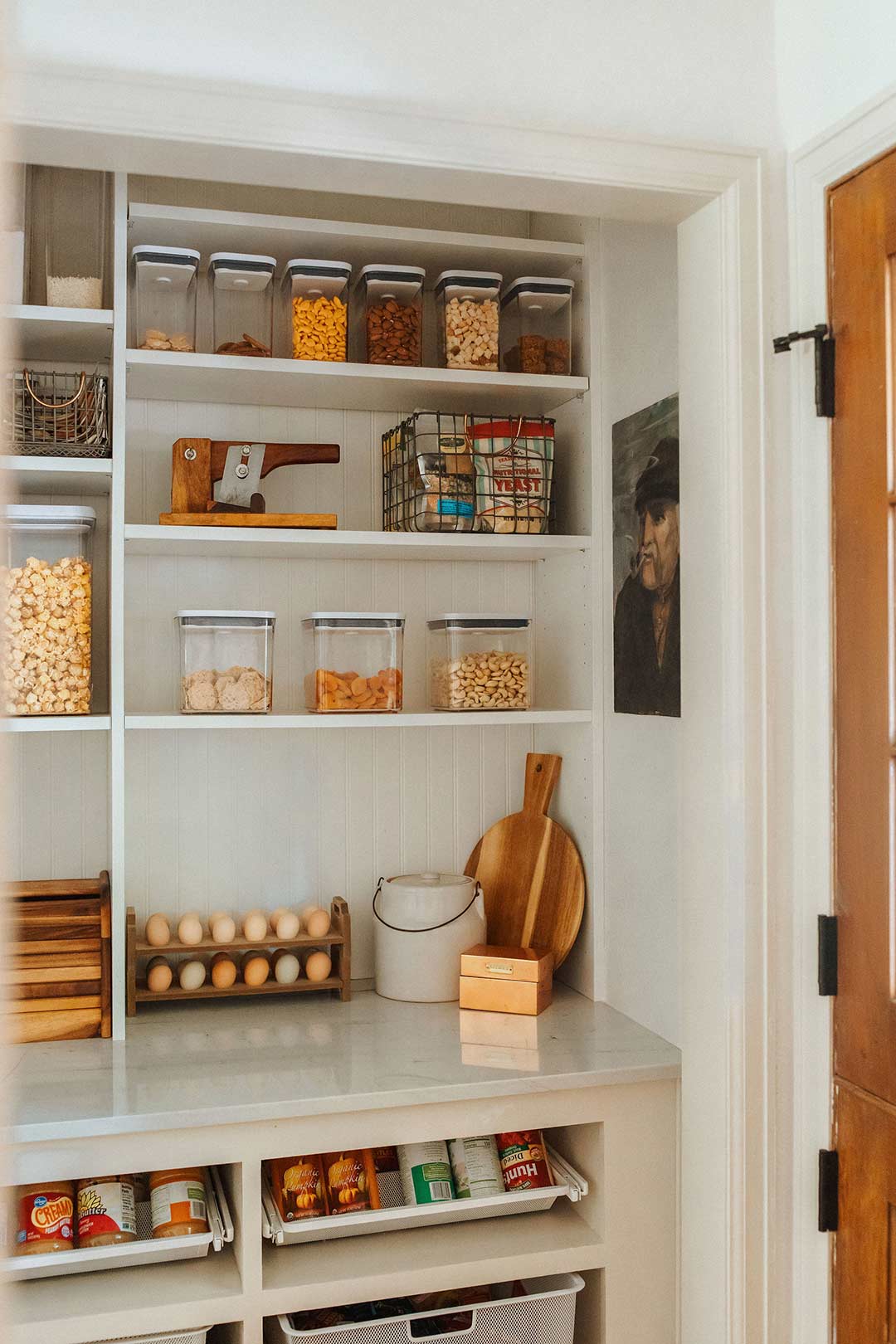 J. Reiko-Design + Co. - Working Pantry - 045 A bright walk-in pantry designed by J. Reiko Design + Co features a blend of modern and classic storage systems - some wood tone, some plastic.