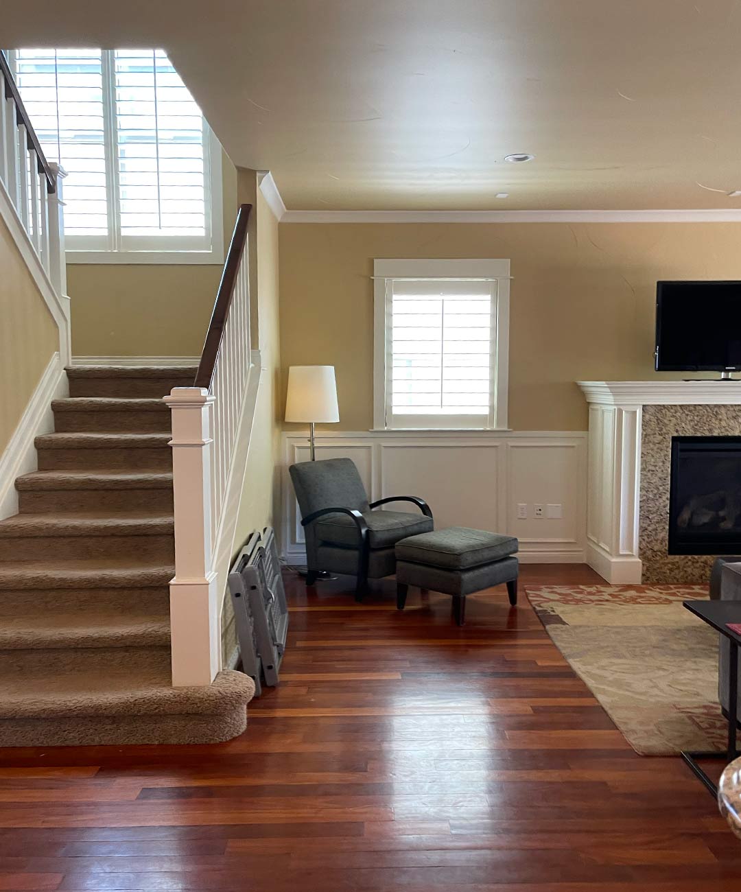 Staircase and fireplace in the living room  'before' image - J. Reiko Design + Co - Hudson Street Project - before and after of a modern classic interior design project