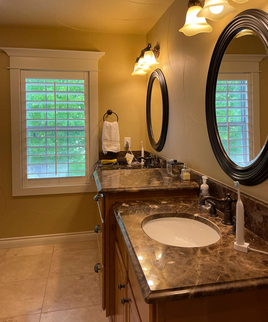 Primary bathroom's double vanity 'before' image - J. Reiko Design + Co - Hudson Street Project - before and after of a modern classic interior design project