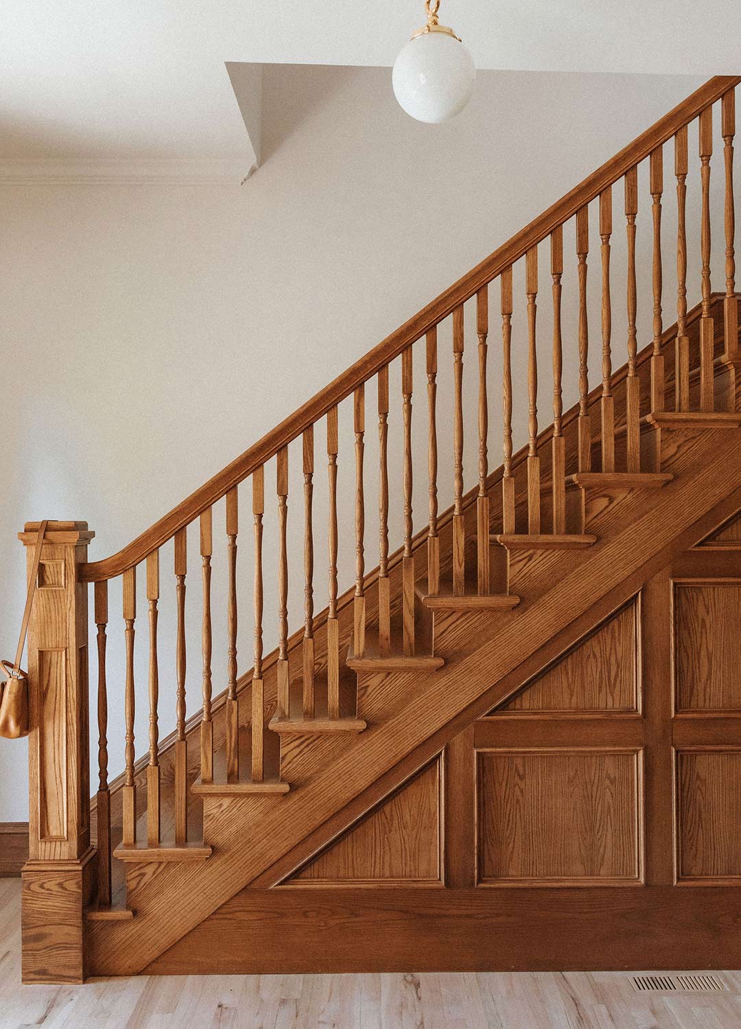 Staircase & custom moulding 'after' image - J. Reiko Design + Co - Julien Street Project - before and after of a Denver Square restoration remodel with Victorian charm and playful English-inspired design