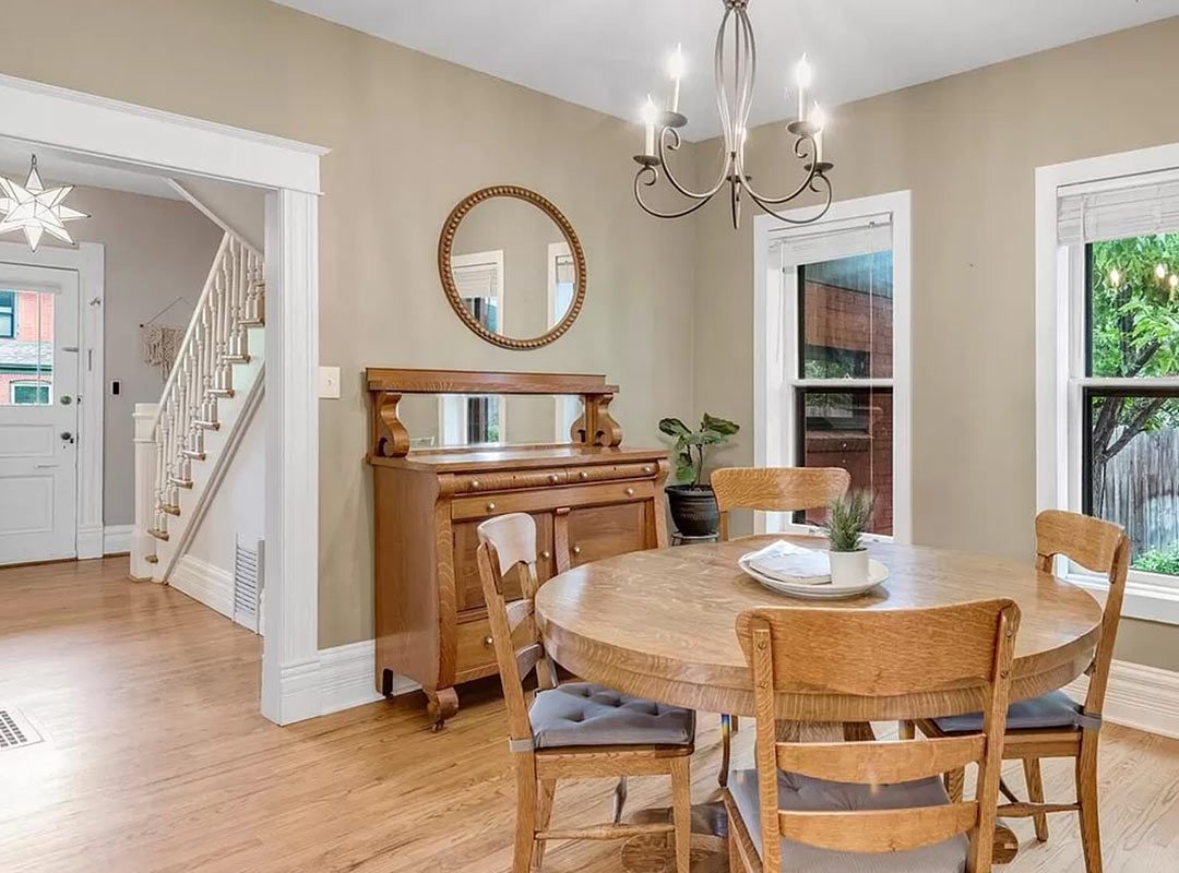 Dining room & stairwell 'before' image - J. Reiko Design + Co - Julien Street Project - before and after of a Denver Square restoration remodel with Victorian charm and playful English-inspired design