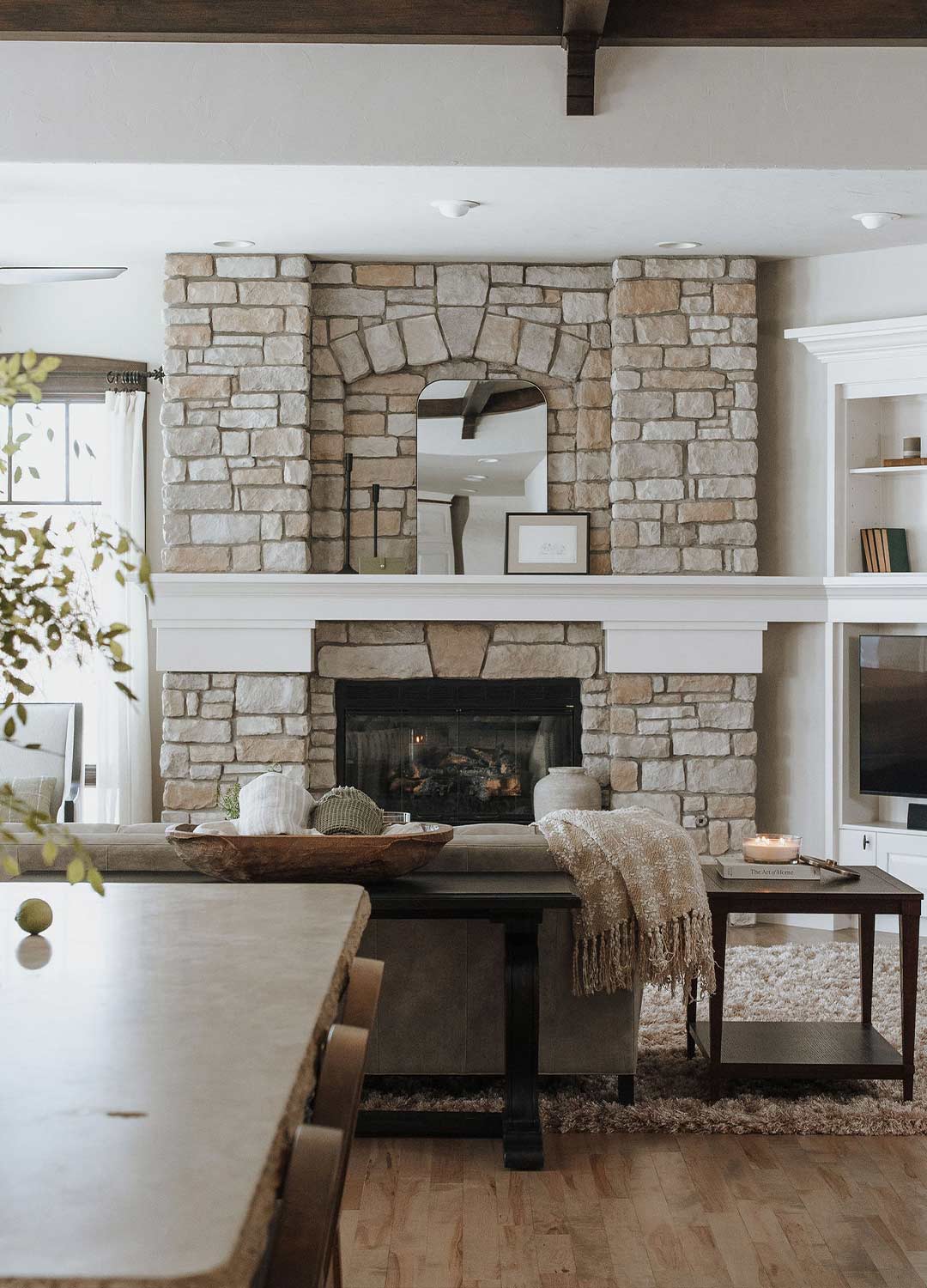 Fireplace 'after' image - J. Reiko Design + Co - Three Eagles Drive Project - before and after of a rustic and traditional mediterranean-inspired home in Fort Collins, Colorado