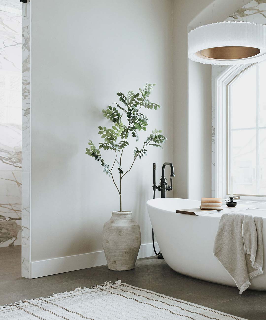 Primary bathroom's tub & shower 'after' image - J. Reiko Design + Co - Three Eagles Drive Project - before and after of a rustic and traditional mediterranean-inspired home in Fort Collins, Colorado