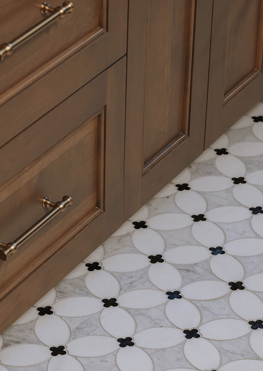 J. Reiko Design + Co. - Modern Colonial Interior Design - 06 Wood vanity detail with brass pull and patterned tile floor in a modern colonial palette.
