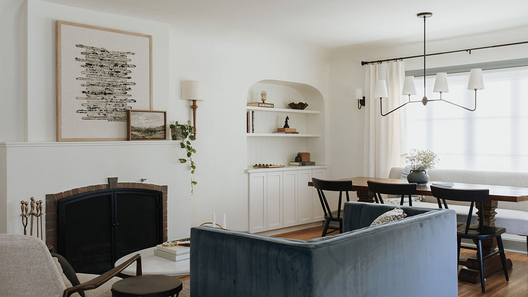 J. Reiko Design + Co. - Modern Colonial Interior Design - 19 After living and dining room with velvet sofa, built-ins, and fireplace as the focal point.