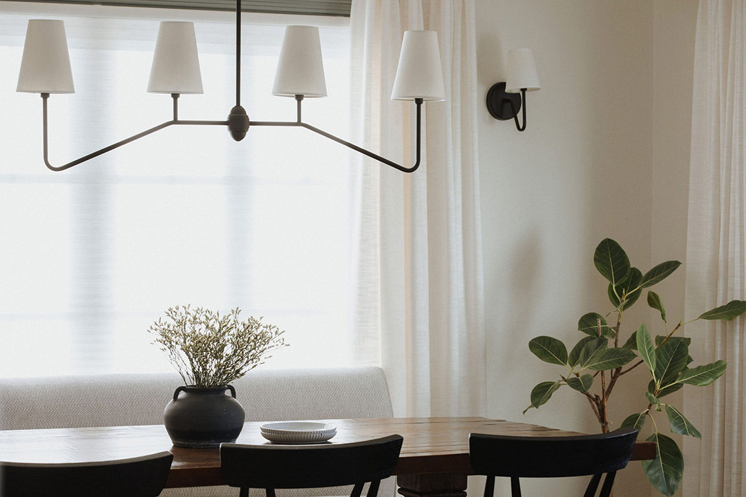 J. Reiko Design + Co. - Modern Colonial Interior Design - 29 Dining detail with modern colonial chandelier, sheer curtains, and simple greenery.