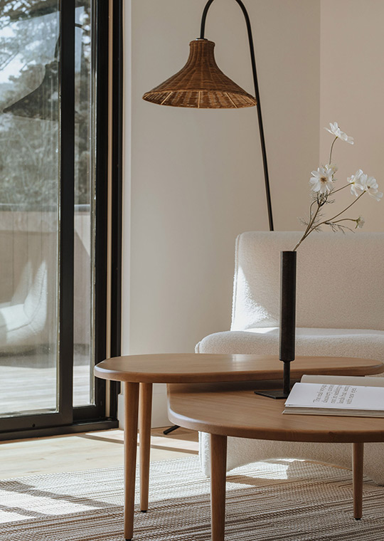 J. Reiko Design + Co. - Quiet Luxury Living Room Ideas - 19 Quiet luxury vignette with woven floor lamp, round nesting tables, and minimalist floral styling.