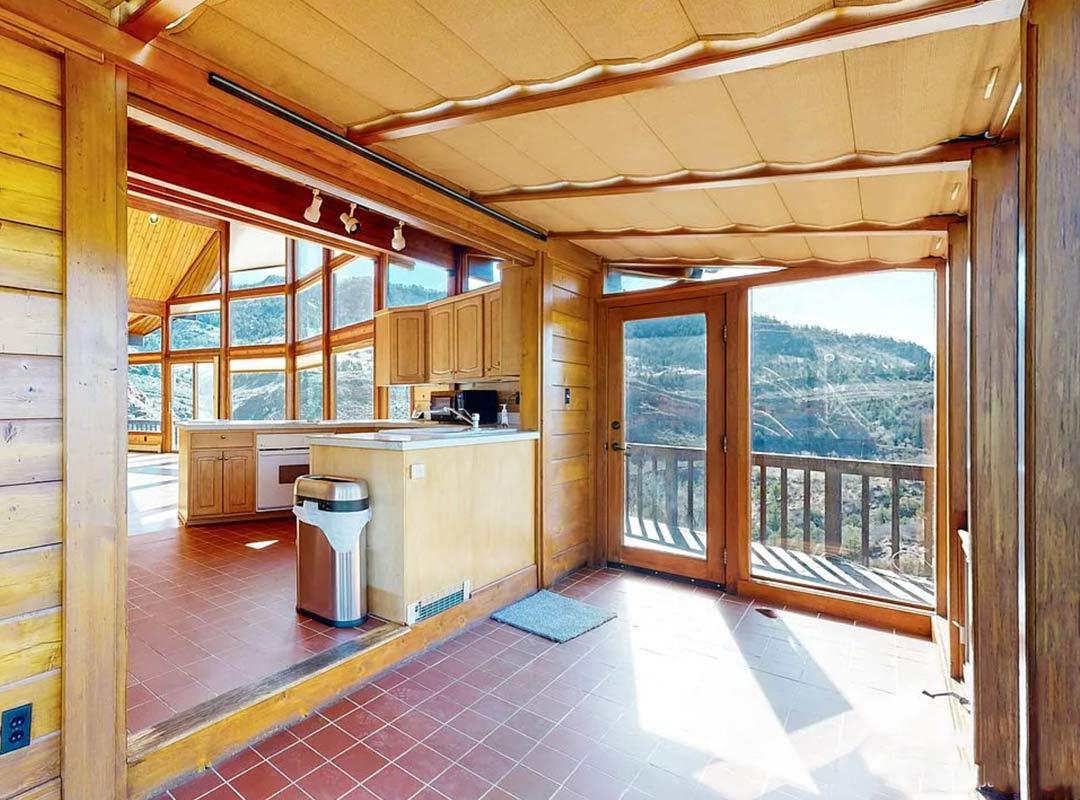 Sunroom 'before' image - J. Reiko Design + Co - Redstone Canyon Project - before and after of a mountain modern remodel in Fort Collins, Colorado