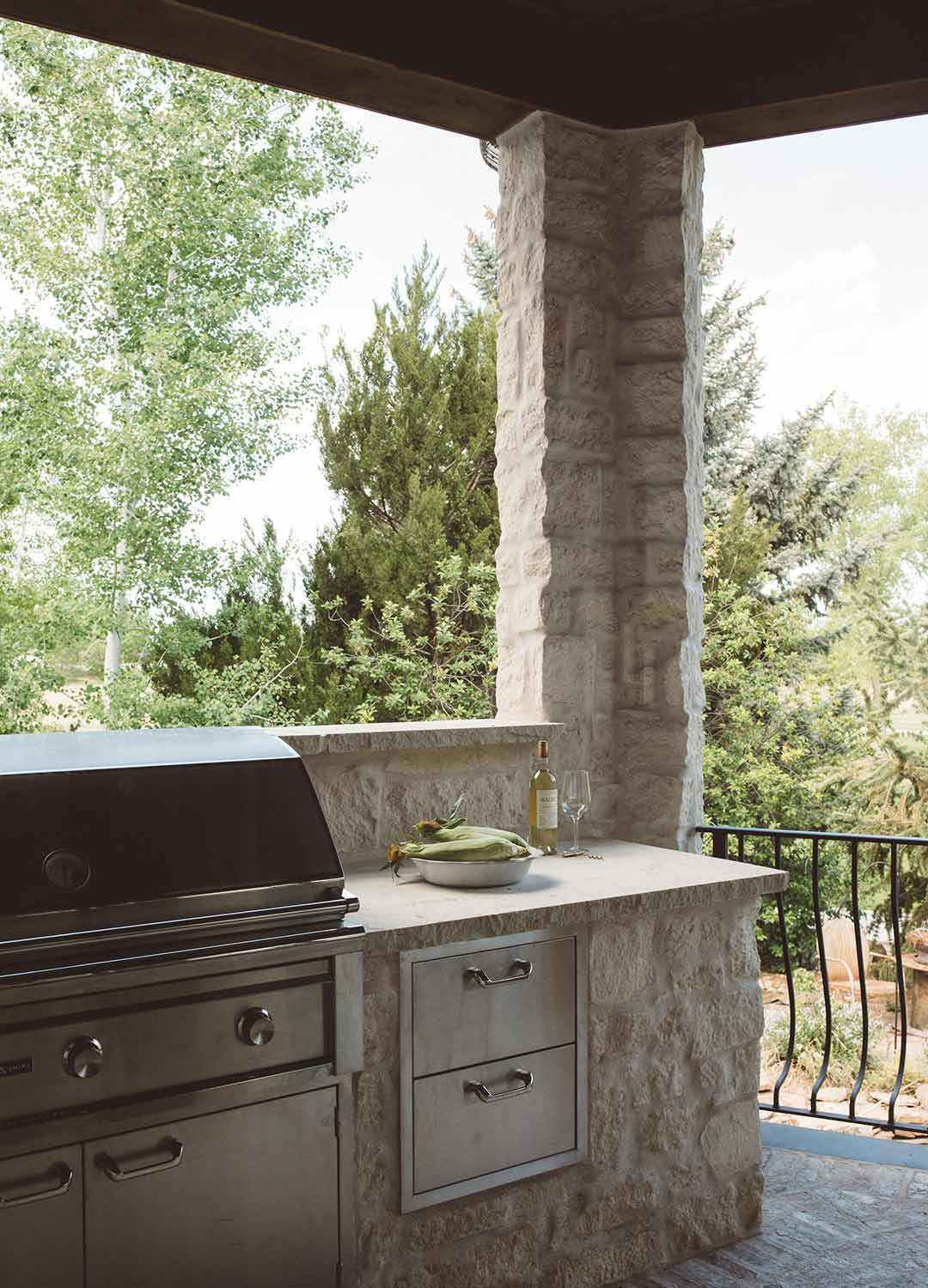 Outdoor kitchen 'after' image - J. Reiko Design + Co - Augusta Trail - before and after of a European farmhouse remodel in Fort Collins, Colorado