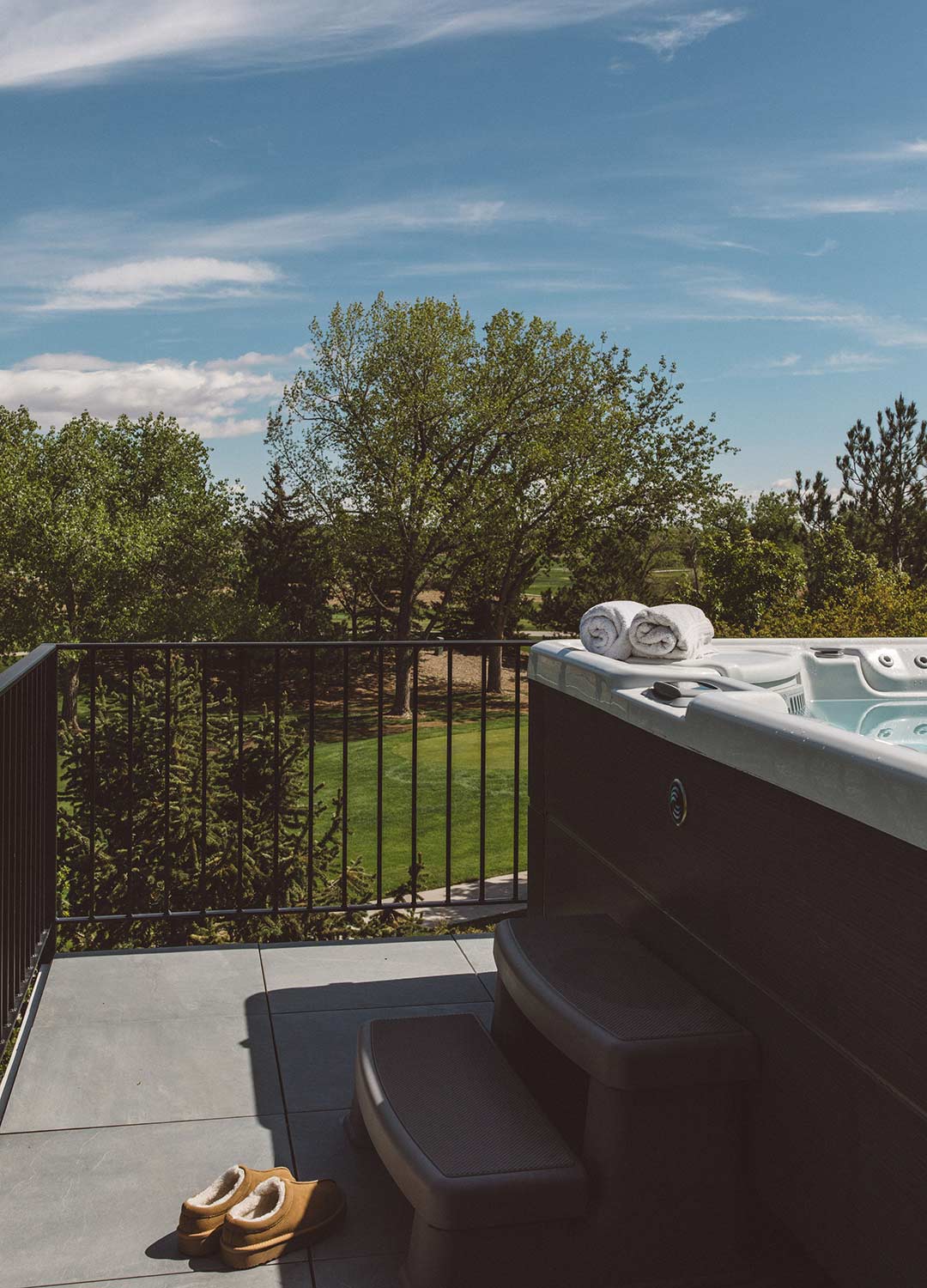 Outdoor hot tub area 'after' image - J. Reiko Design + Co - Augusta Trail - before and after of a European farmhouse remodel in Fort Collins, Colorado