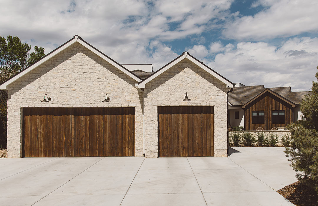 Exterior garage 'after' image - J. Reiko Design + Co - Augusta Trail - before and after of a European farmhouse remodel in Fort Collins, Colorado